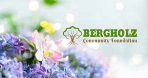 Bright spring flowers and the Bergholz Community Foundation logo