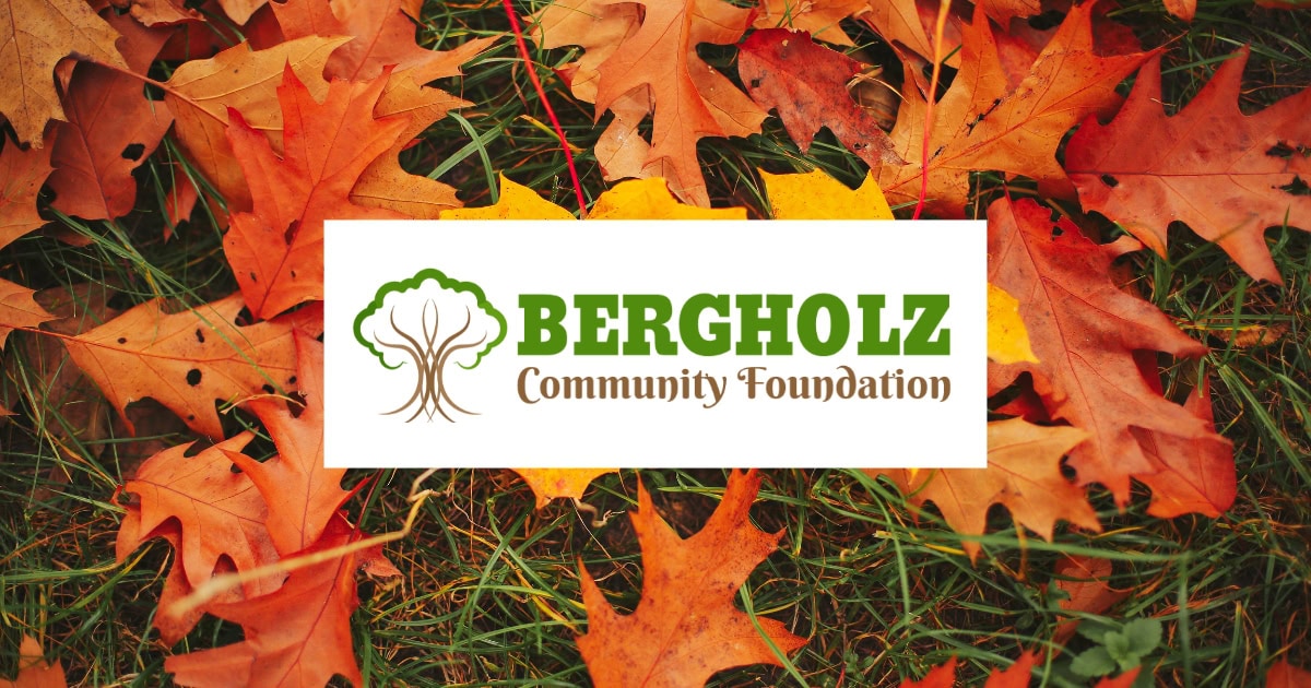 Fall leaves on the ground and the Bergholz Community Foundation logo