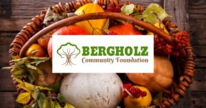 Basket full of Fall produce and the Bergholz Community Foundation logo